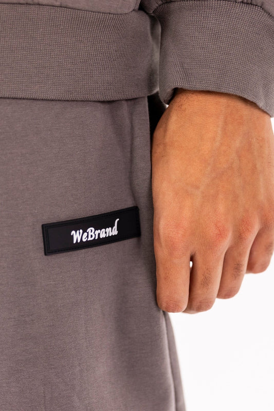 Gray sweatshirt with 'WeBrand' logo on a white background