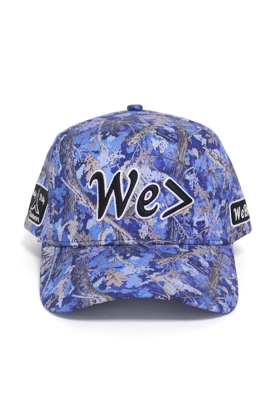 Blue camouflage baseball cap with 'We>' logo on a white background