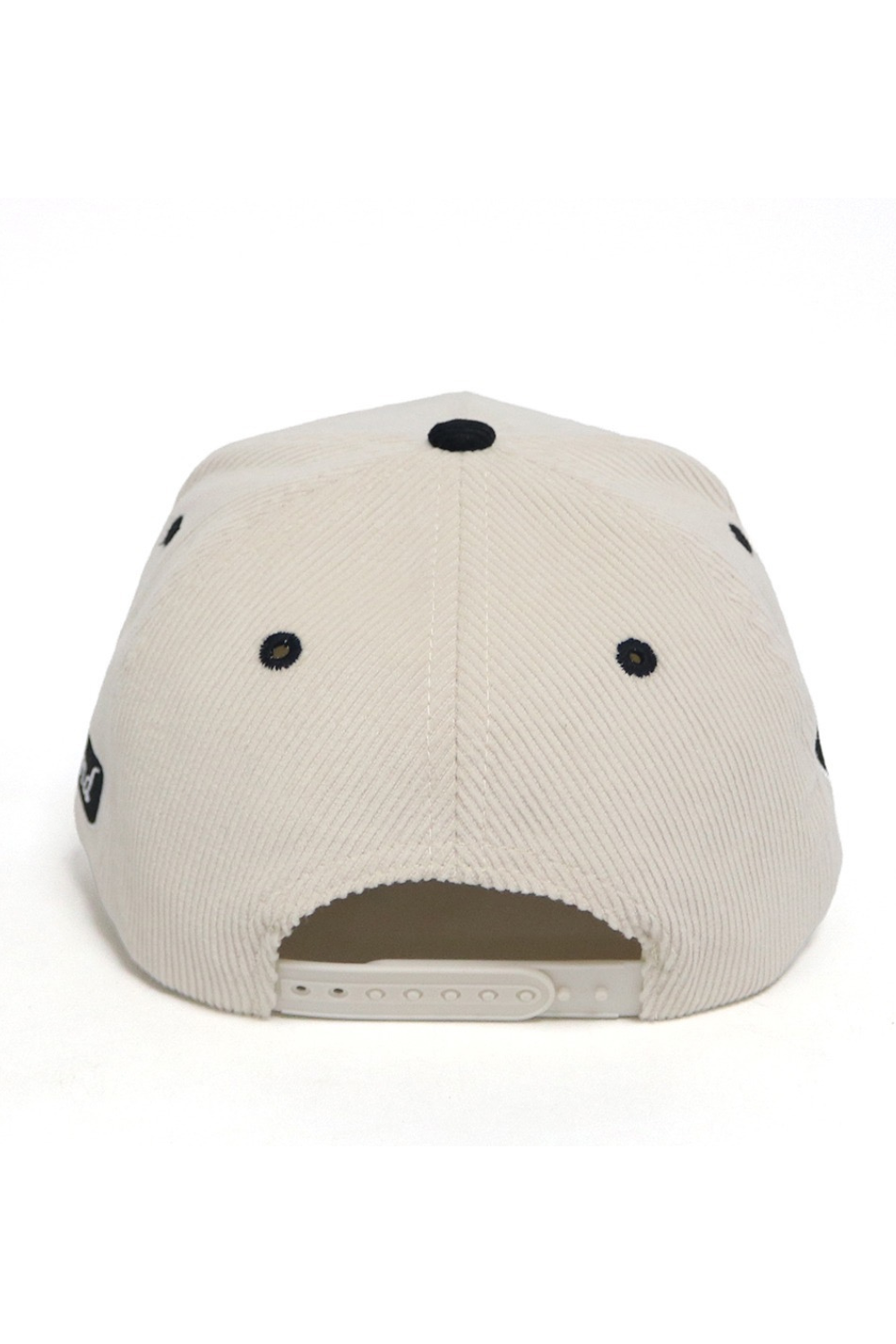 Back view of a beige cap with black accents on a white background