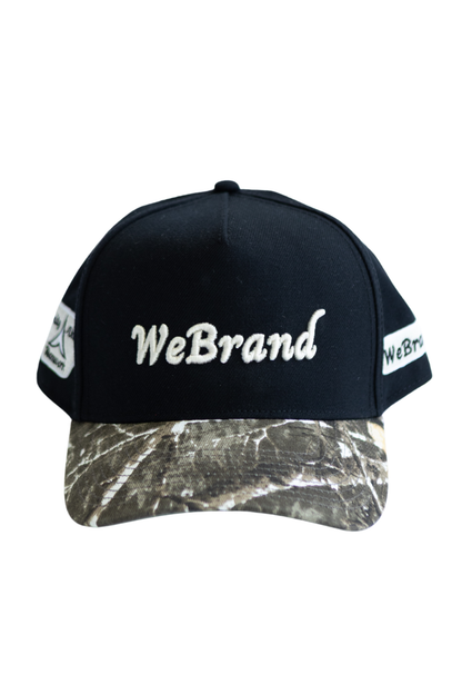 Black cap with camouflage bill and 'WeBrand' logo on a white background