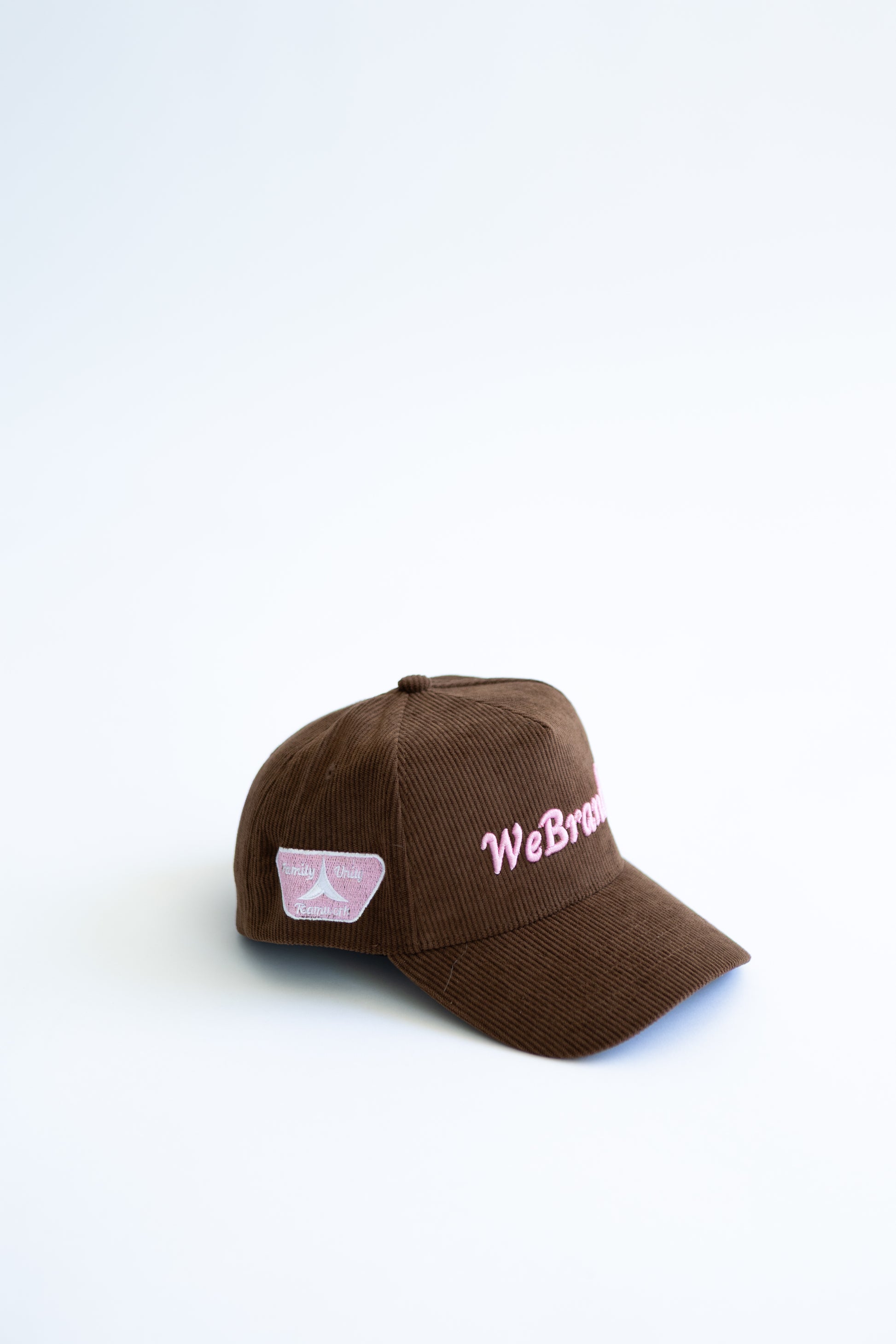 Brown cap with 'WeBrand' branding on a white background