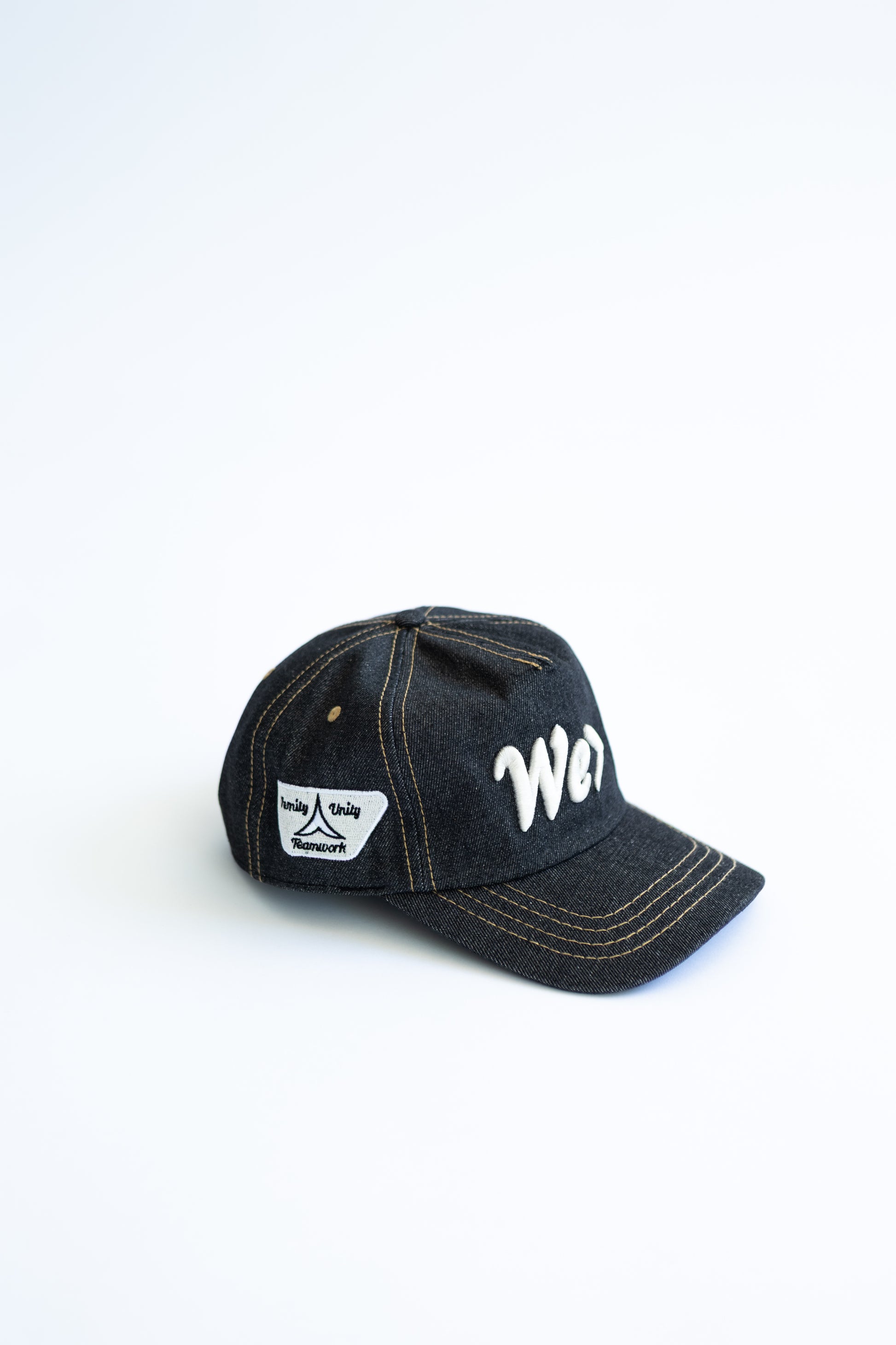Denim cap with white text on a white background