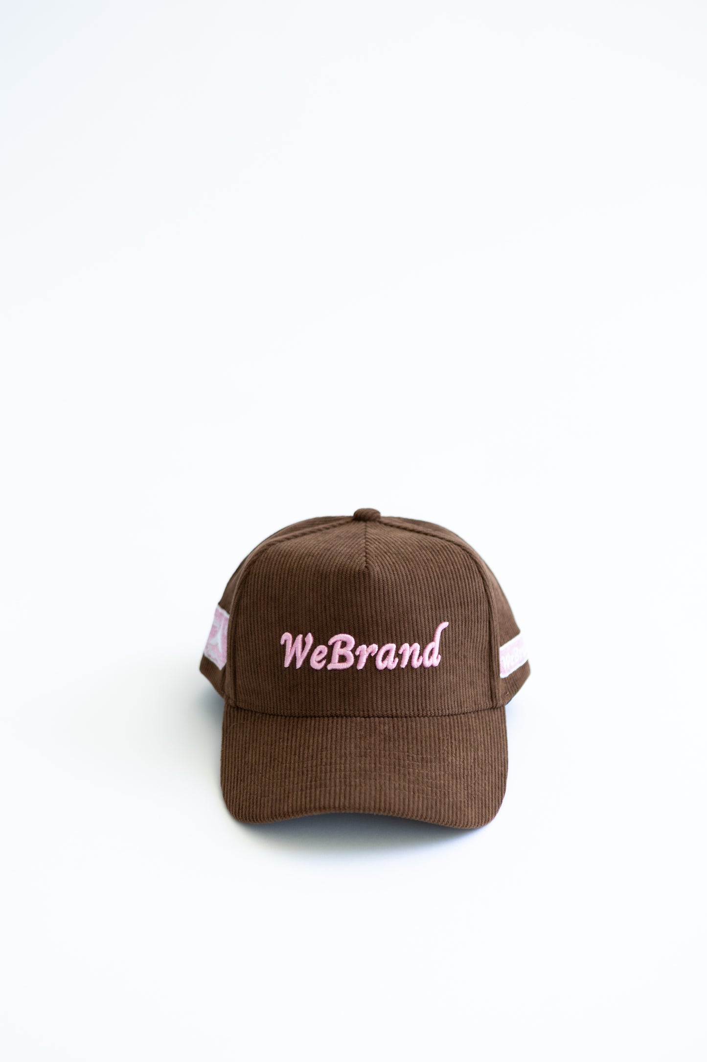 Brown cap with 'WeBrand' logo on a white background