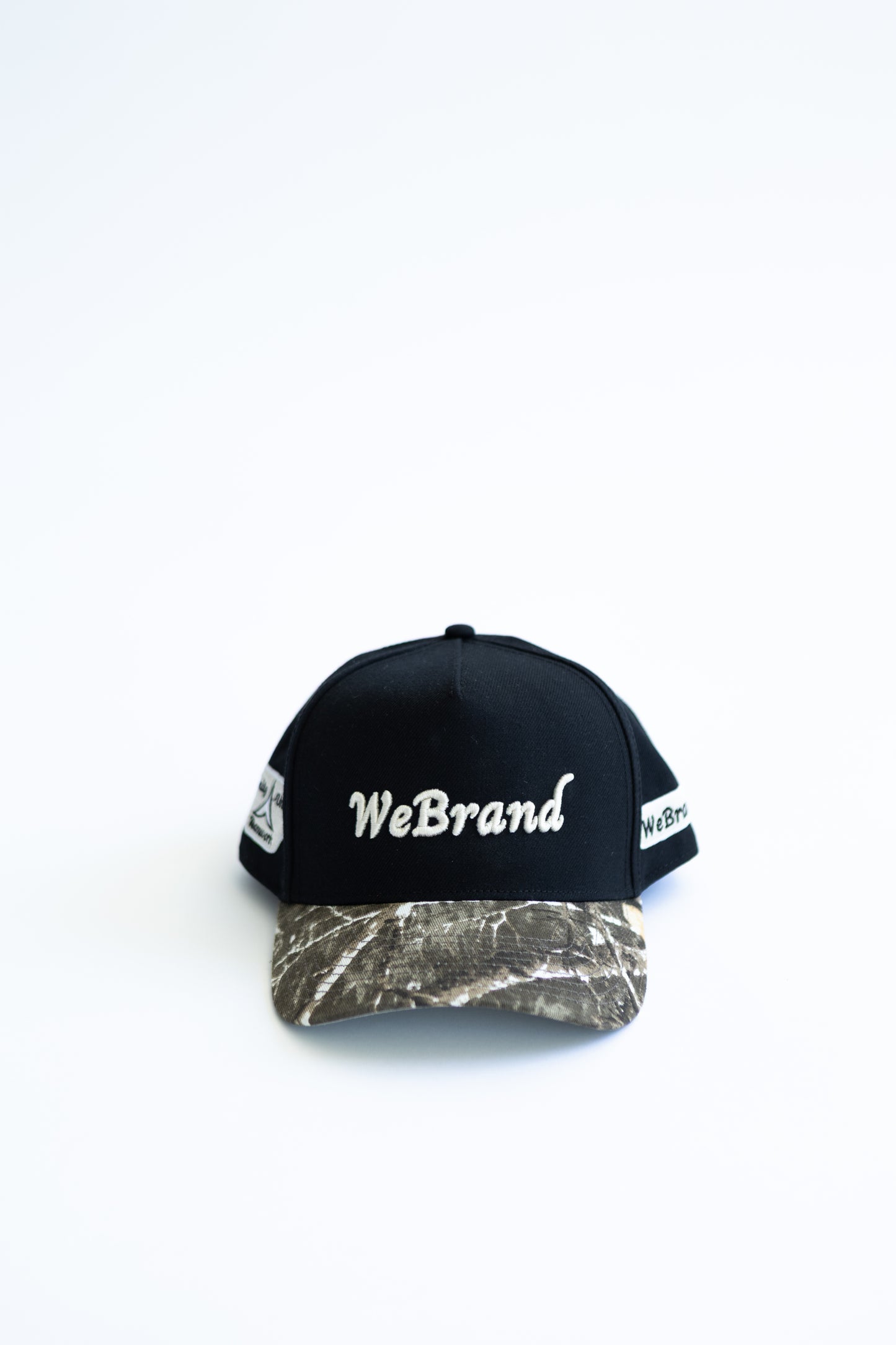 Black cap with 'WeBrand' logo on a white background