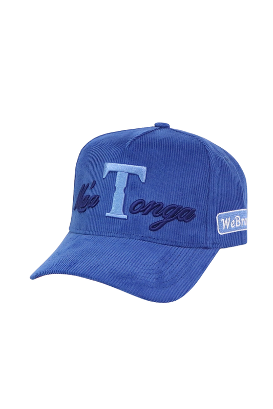 A blue corduroy baseball cap featuring an embroidered light blue 'T Tonga' logo on the front and a white 'WeBricks' brand patch on the side, set against a plain white background.