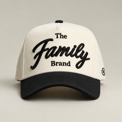The Family Brand cream corduroy hat with black embroidered logo and curved brim